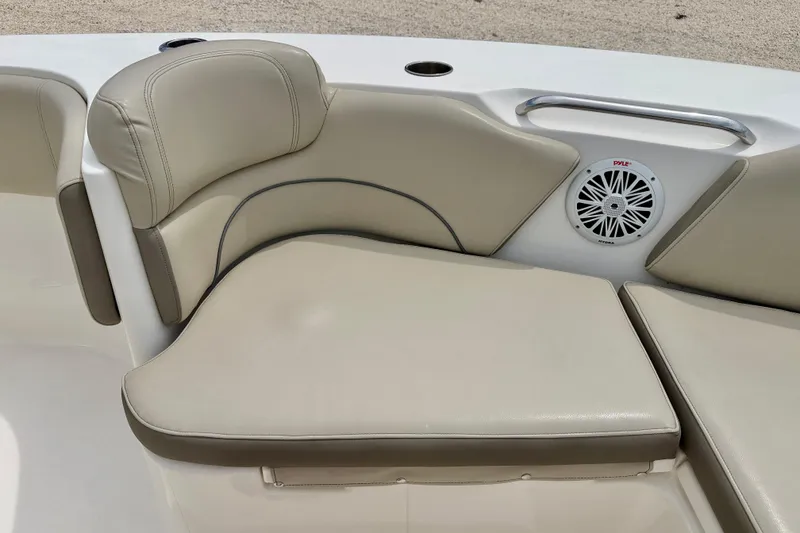 Slide: The Image of 2021 Key West 263 FS boat seating with beige cushions and built-in speaker. - 25