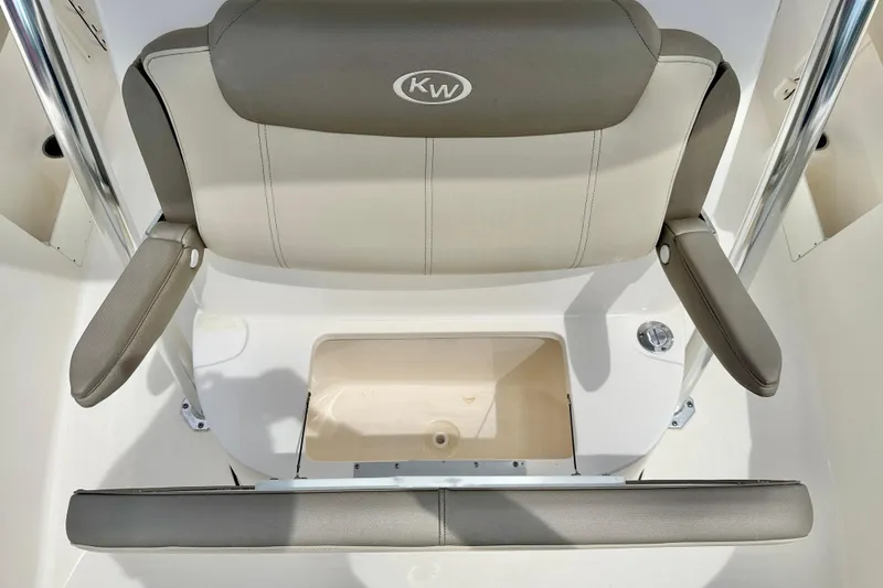 Slide: The Image of 2021 Key West 263 FS boat seat with storage compartment and armrests. - 27