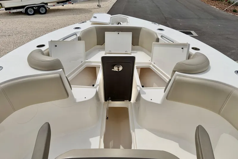 Slide: The Image of 2021 Key West 263 FS boat interior with open storage compartments and seating. - 28