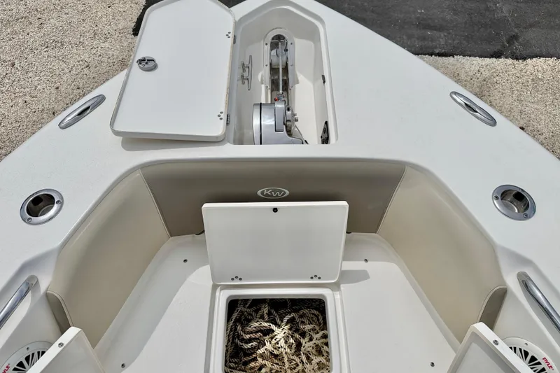 Slide: The Image of 2021 Key West 263 FS boat deck with storage compartments and anchor system. - 32