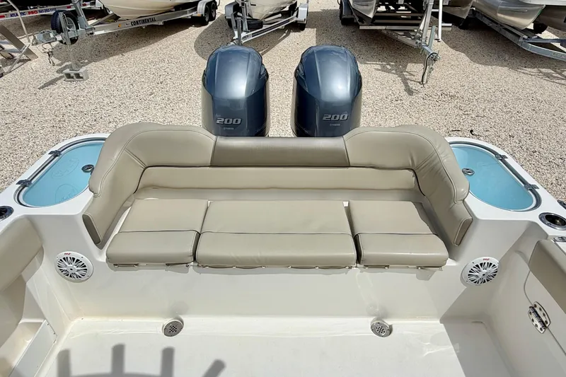 Slide: The Image of 2021 Key West 263 FS boat interior with seating and dual outboard motors. - 34