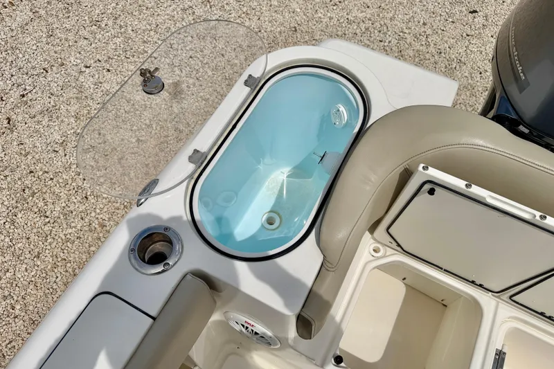 Slide: The Image of 2021 Key West 263 FS boat interior with livewell and storage compartments. - 37
