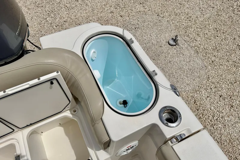 Slide: The Image of Livewell and seating area on 2021 Key West 263 FS boat, featuring storage compartments. - 38