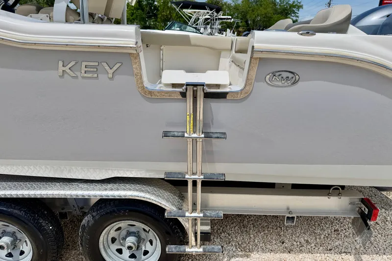 Slide: The Image of 2021 Key West 263 FS boat with ladder on trailer, side view. - 40