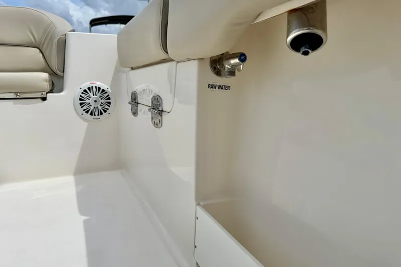 Slide: The Image of 2021 Key West 263 FS boat interior with speaker and raw water outlet. - 43
