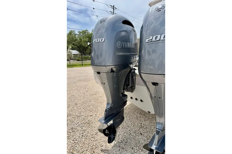 Slide: The Image of Twin Yamaha 200 outboard engines on a 2021 Key West 263 FS boat. - 48