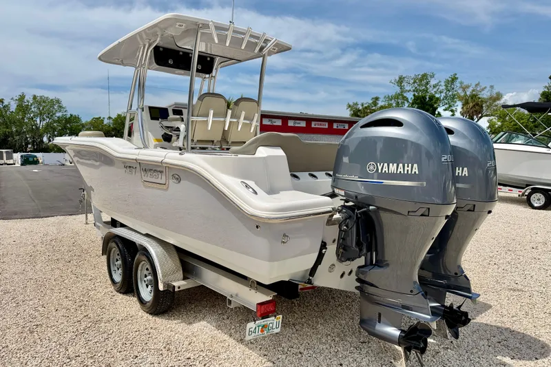 Slide: The Image of 2021 Key West 263 FS boat with dual Yamaha engines on a trailer. - 7
