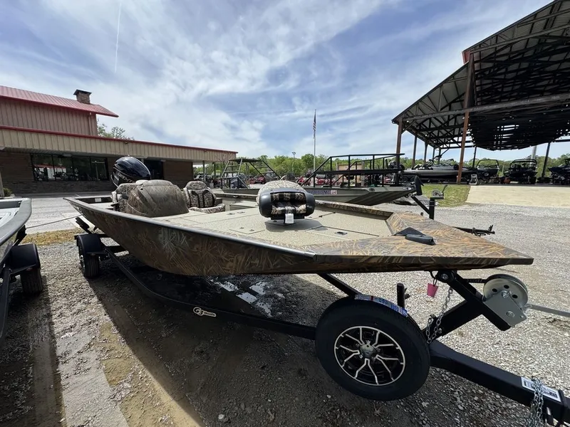 Slide: The Image of 2026 G3 Sportsman 1810 PFX boat on trailer outdoors. - 1