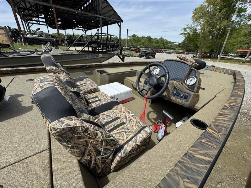 Slide: The Image of 2026 G3 Sportsman 1810 PFX boat with camo-pattern seats and steering console. - 5