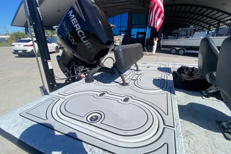 Slide: The Image of 2020 Coastal Custom Boats 23' Fury with Mercury 300XS engine, docked near a marina. - 11