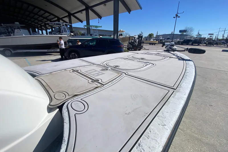 Slide: The Image of 2020 Coastal Custom Boats 23' Fury docked, showcasing deck design and marina setting. - 13