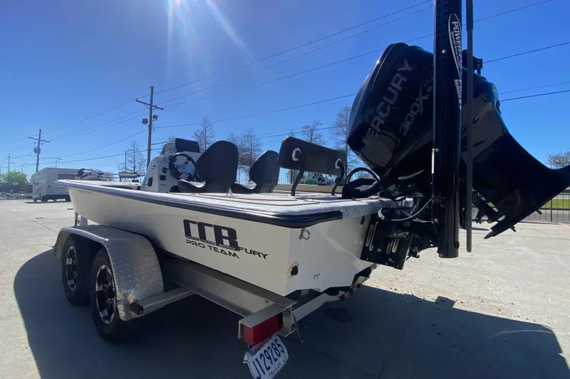 Slide: The Image of 2020 Coastal Custom Boats 23' Fury with Mercury 300XS engine on trailer, sunny day. - 6