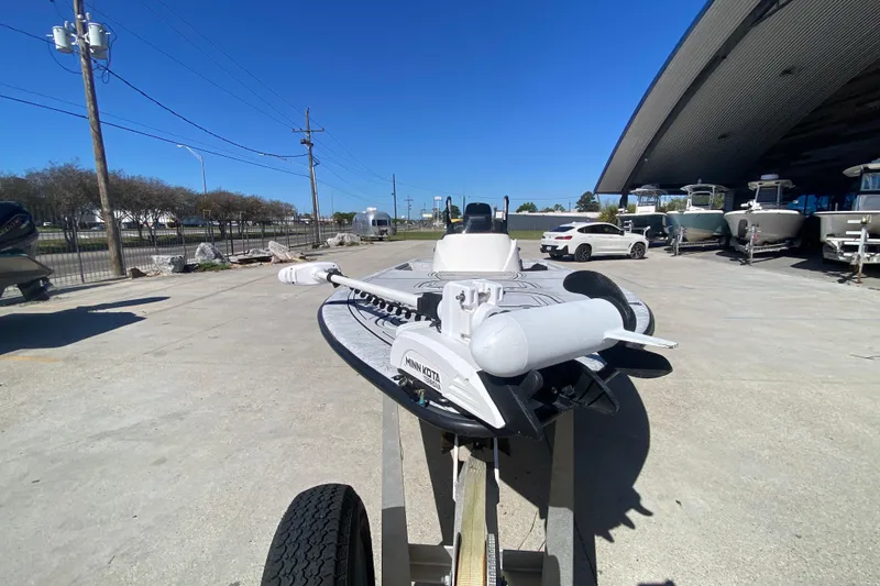 Slide: The Image of 2020 Coastal Custom Boats 23' Fury on trailer, parked outdoors under clear blue sky. - 9