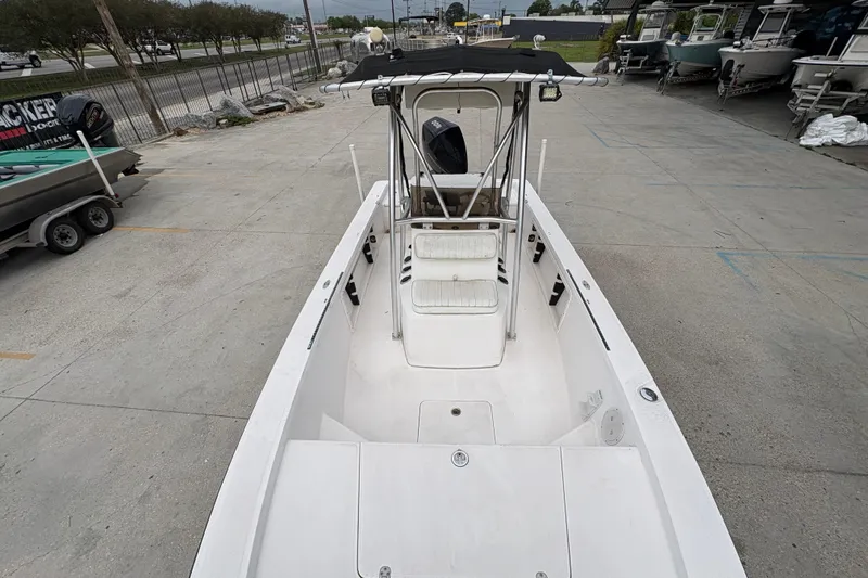 Slide: The Image of Kenner 21 VISION 2000 boat with center console, parked on concrete lot. - 12