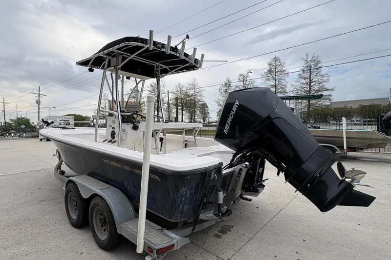 Slide: The Image of Kenner 21 VISION 2000 boat with Mercury engine on a trailer. - 6