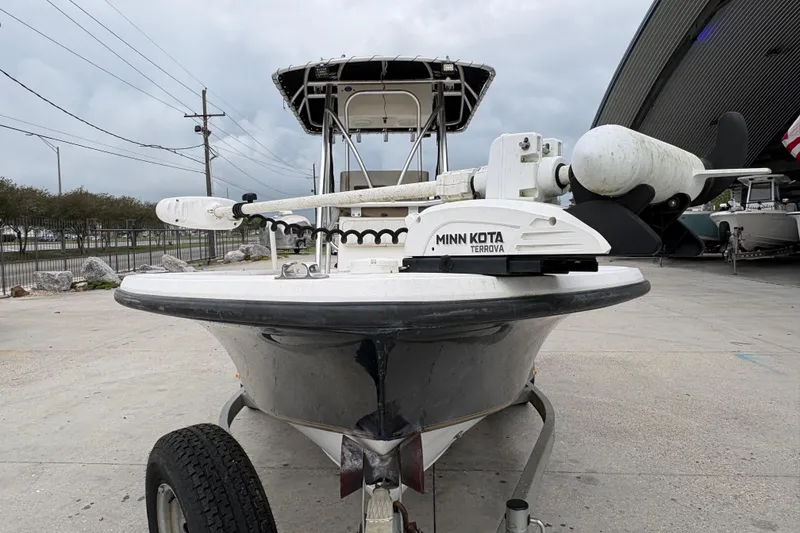 Slide: The Image of Kenner 21 VISION boat with Minn Kota Terrova motor, parked outdoors, 2000 model. - 9