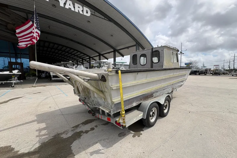 Slide: The Image of 1972 Custom 23' work/push boat on trailer outside boatyard. - 4