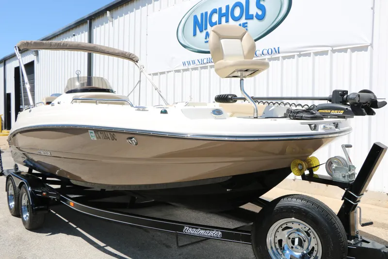 Slide: The Image of 2015 Stingray 192 SC boat on trailer outside Nichols Marine dealership. - 3
