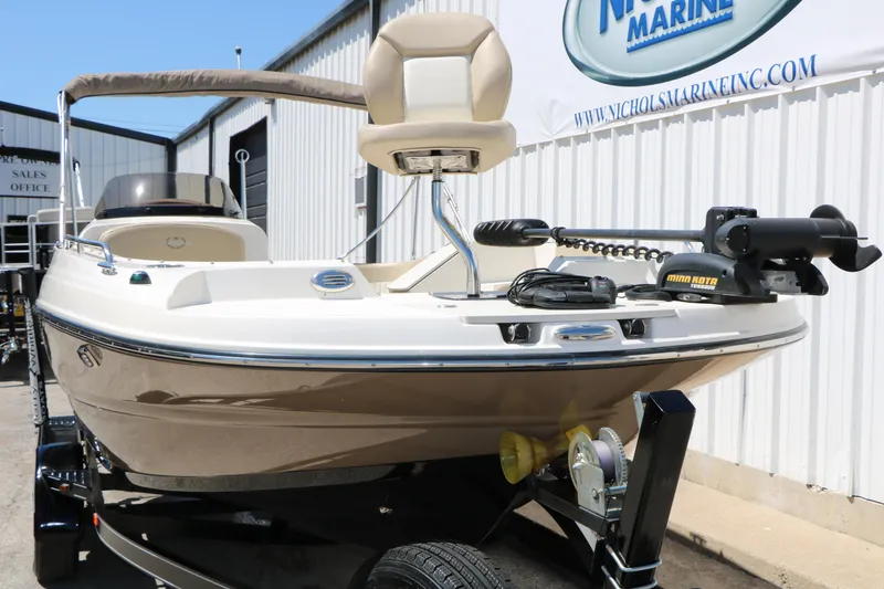 Slide: The Image of 2015 Stingray 192 SC boat on trailer at Nichols Marine dealership. - 4