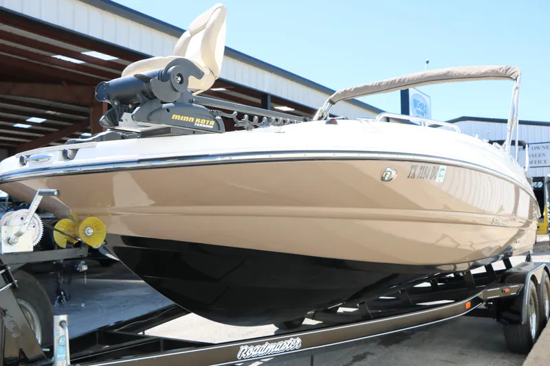 Slide: The Image of 2015 Stingray 192 SC boat on trailer, equipped with Minn Kota trolling motor. - 6
