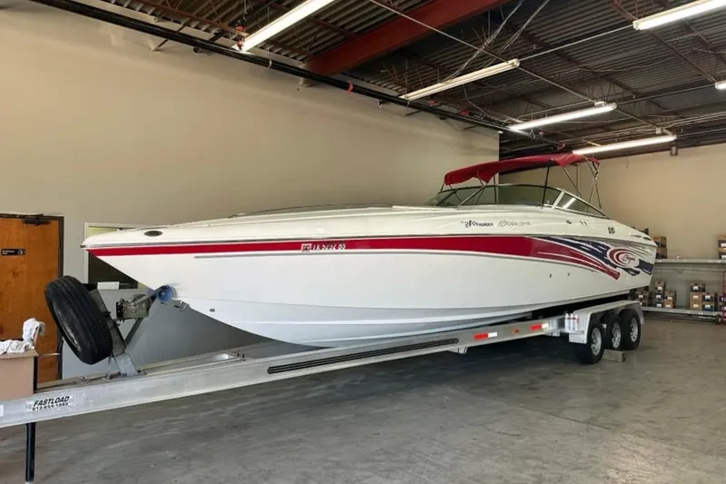Slide: The Image of 2005 Baja 342 Boss speedboat on trailer in warehouse setting. - 2
