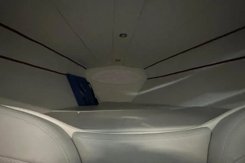 Slide: The Image of Interior cabin of a 2005 Baja 342 Boss boat, featuring sleek, modern design. - 5