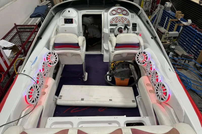 Slide: The Image of Interior of a 2005 Baja 342 Boss boat with illuminated speakers and dual seating. - 7