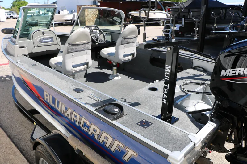 Slide: The Image of 2008 Alumacraft Dominator 165 Sport boat with Mercury engine, interior view. - 10