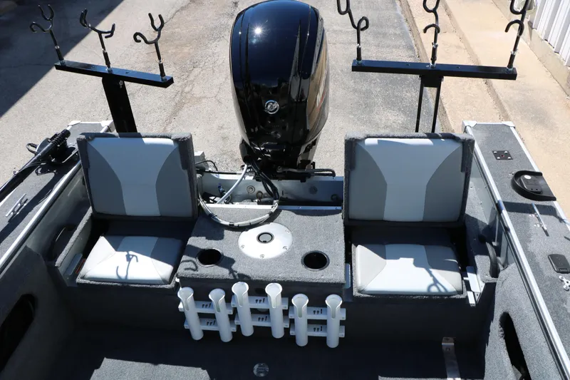 Slide: The Image of 2008 Alumacraft Dominator 165 Sport boat interior with seating and fishing rod holders. - 18