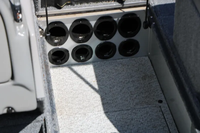 Slide: The Image of 2008 Alumacraft Dominator 165 Sport boat interior with rod storage compartments. - 22