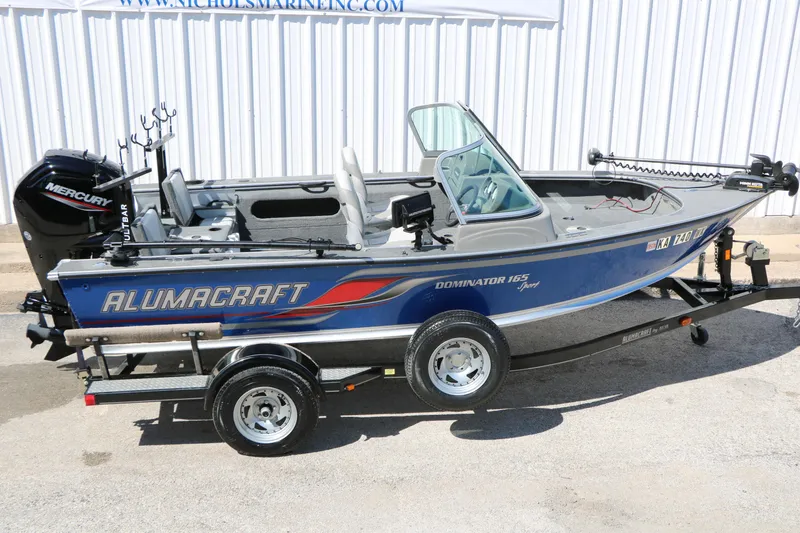 Slide: The Image of 2008 Alumacraft Dominator 165 Sport boat with Mercury engine on trailer. - 25