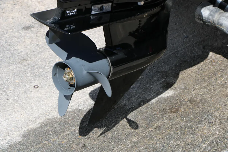 Slide: The Image of 2008 Alumacraft Dominator 165 Sport boat propeller on concrete surface. - 9