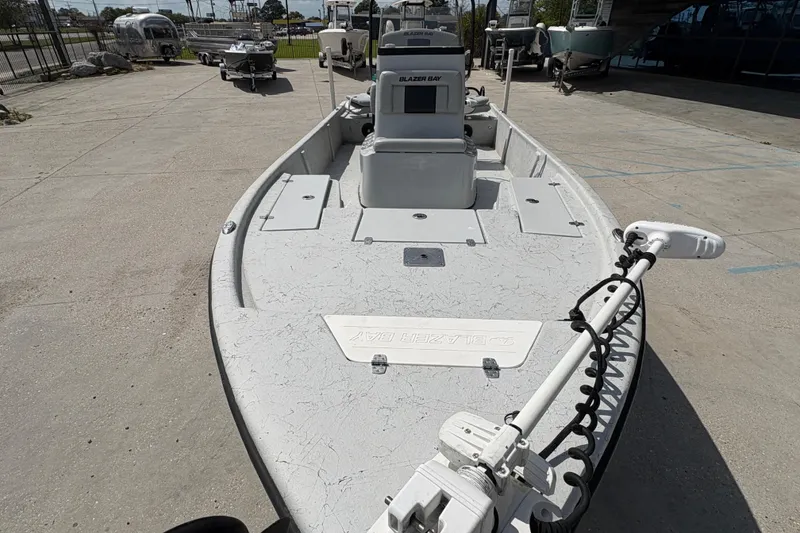 Slide: The Image of 2020 Blazer Bay 2170 boat on display in a marina setting. - 11