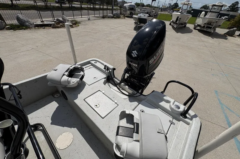 Slide: The Image of 2020 Blazer Bay 2170 boat with Suzuki outboard motor in a parking lot. - 18