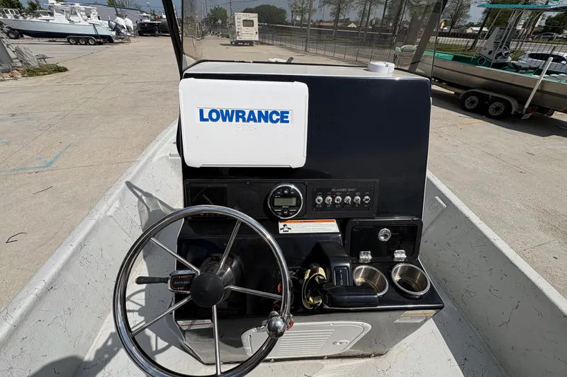 Slide: The Image of 2020 Blazer Bay 2170 boat console with Lowrance HDS system and steering wheel. - 21
