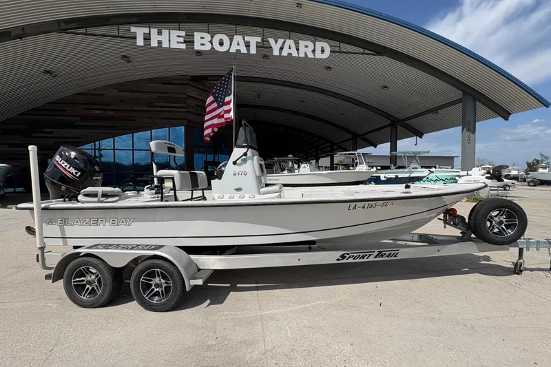 Slide: The Image of 2020 Blazer Bay 2170 boat on trailer at The Boat Yard, featuring Suzuki engine. - 3