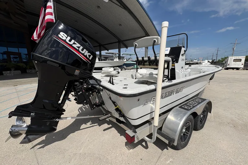 Slide: The Image of 2020 Blazer Bay 2170 boat with Suzuki outboard motor on trailer. - 4