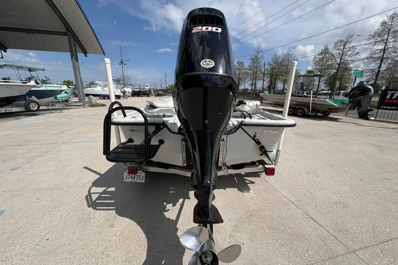 Slide: The Image of 2020 Blazer Bay 2170 boat with powerful outboard motor in a marina setting. - 5