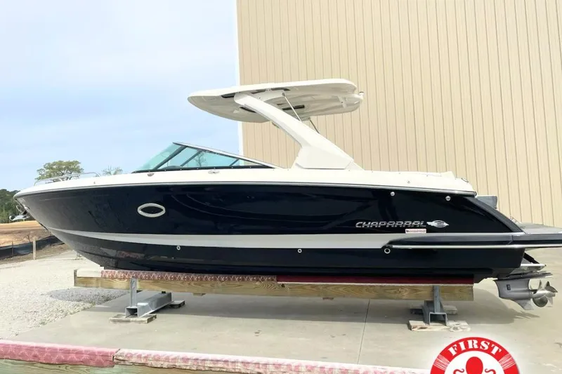 The Image of 2019 Chaparral 297 SSX boat displayed on a stand, side view. - 0