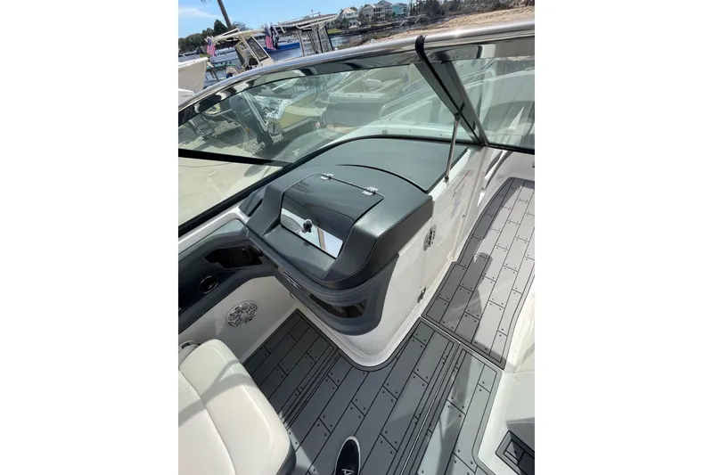 Slide: The Image of 2019 Chaparral 297 SSX boat interior with sleek design and modern dashboard. - 11