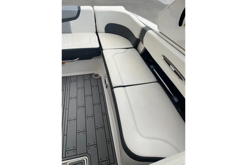 Slide: The Image of 2019 Chaparral 297 SSX boat interior with white and gray seating. - 16