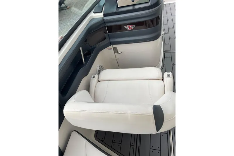 Slide: The Image of 2019 Chaparral 297 SSX boat interior with white seating and sleek design. - 23