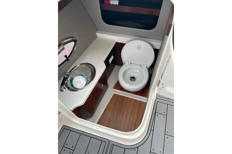 Slide: The Image of 2019 Chaparral 297 SSX boat bathroom with sink and toilet. - 27