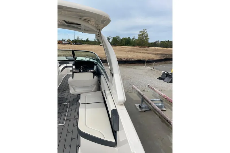 Slide: The Image of 2019 Chaparral 297 SSX boat interior with seating and steering wheel. - 32