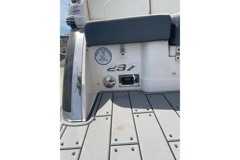 Slide: The Image of 2019 Chaparral 297 SSX boat stern with logo and dock details. - 36