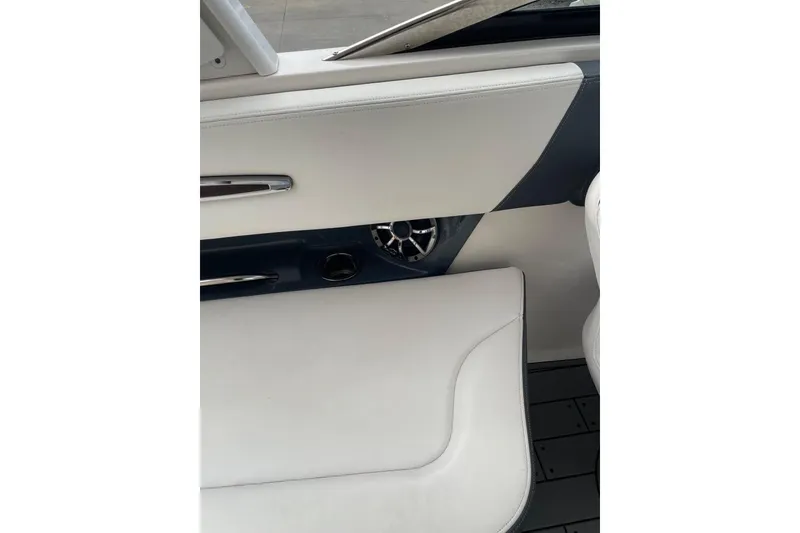 Slide: The Image of Interior view of 2019 Chaparral 297 SSX boat, featuring sleek white seating and modern design. - 4