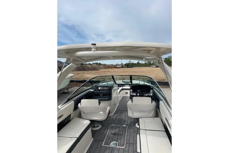 Slide: The Image of 2019 Chaparral 297 SSX boat interior with sleek seating and modern dashboard. - 41
