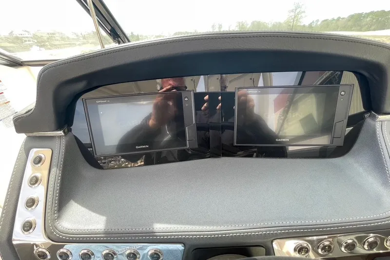 Slide: The Image of Dashboard of 2019 Chaparral 297 SSX with dual Garmin displays. - 42