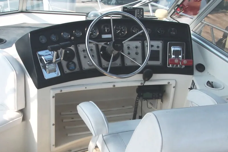 Slide: The Image of 1996 Carver 330 Mariner helm with control instruments. - 15