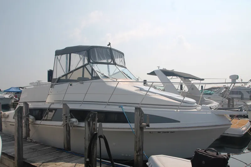 Slide: The Image of 1996 Carver 330 Mariner yacht docked at marina. - 2